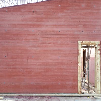 Red Pigment Concrete with a boardmark Finish