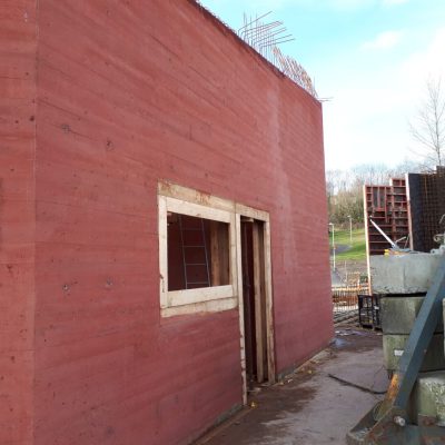 Red Pigment Concrete with a boardmark Finish