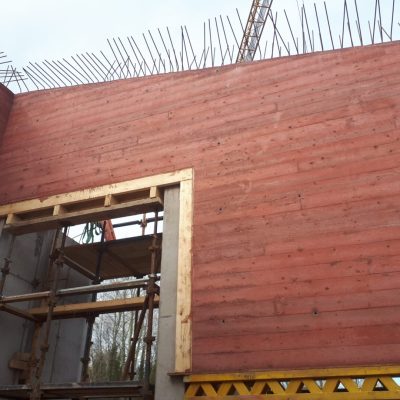 Red Pigment Concrete with a boardmark Finish