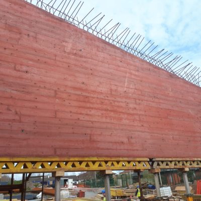 Red Pigment Concrete with a boardmark Finish
